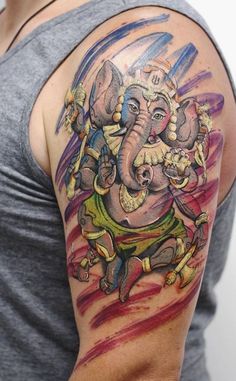 a man with an elephant tattoo on his arm