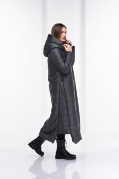 "Plus Size Winter Coat, Quilted Jacket, Winter Coat Women This quilted winter jacket has two side pockets, large and cozy hood, extravagant asymmetrical design on both sides. The long double side zipper and the high collar will keep comfy yet so stylish and chic. This urban style jacket has the street vibe and will keep you warm for sure. Review from our customer about this model: \"I am wild about this coat! It's gorgeous, fits beautifully, is so very well-designed. It's a perfect puffer withou Goth Coat, Black Cape Coat, Long Hooded Coat, Gothic Coat, Long Down Coat, Black Puffer Jacket, Quilted Puffer Jacket, Cape Coat, Black Puffer