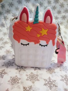 Super cute unicorn popper purse with zipper and adjustable strap. Makes the perfect gift for that little girl who loves unicorns! 5.5" x 3.5" x 1.2" Cute Unicorn, Novelty Lamp, Super Cute, Purse, Novelty Christmas, Perfect Gift, Christmas Ornaments, Zipper, Holiday Decor