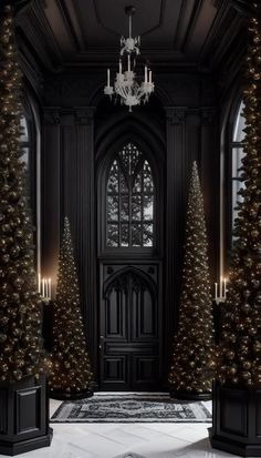 a black door with christmas trees and chandelier