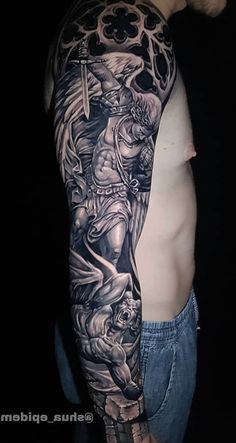 a man's half sleeve with an angel and demon tattoo on his left arm