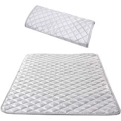 the mattress pad and pillow are both white