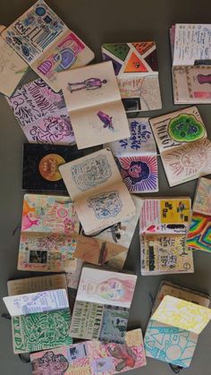 many different types of paper and stickers on a table with scissors, markers, etc