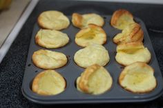 muffins in a baking pan on top of a stove