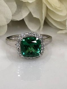 Cushion Cut Emerald And Genuine Diamond Halo Style Ring  Set In 14K White Gold #5459 Formal Halo Diamond Ring With May Birthstone, Formal Diamond Halo Ring For May Birthstone, Formal May Birthstone Diamond Ring With Halo Design, Formal Emerald Ring With Halo And Round Cut, Formal Emerald Ring With Halo, Formal Emerald Halo Ring With Round Cut, Formal Green Rings With Halo Setting, Green Diamond Halo Ring With Brilliant Cut, Green Diamond Ring With Halo Design