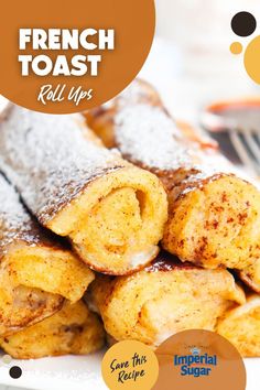 french toast roll ups on a plate with powdered sugar