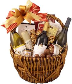 a wicker basket filled with wine and cheese