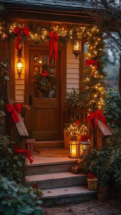 the front door is decorated with christmas lights and wreaths for holiday decorations, including red bows