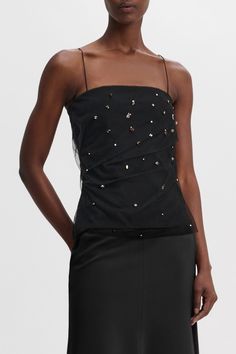 It's okay to look this good: The strapless top is crafted in Punto Milano and has a built-in corset. The top has a hidden side zip closure and tulle overlay, which is embellished with sequins. 67 % Viscose, 28 % Polyamide, 5 % Elastane Strapless top in Punto Milano with embellished tulle overlay Built-in corset Optional spaghetti straps Hidden side zip closure Belt loops Hand wash program / Machine wash Wash with similar colors Our model is 179 cm tall and wears a size S Fitted DOROTHEE SCHUMACH Glamorous Party Tops With Boned Bodice, Glamorous Party Top With Boned Bodice, Fitted Bodice Sleeveless Evening Tops, Sleeveless Fitted Bodice Top For Evening, Sleeveless Fitted Bodice Evening Top, Sleeveless Tops With Fitted Bodice For Evening, Black Fitted Bodice Top For Evening, Strapless Embellished Evening Corset, Black Evening Top With Fitted Bodice