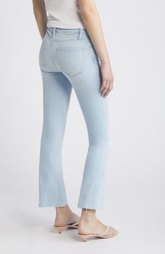 A jagged raw-edge hemline with heavy fraying brings an old-favorite vibe to crop-leg jeans cut in a subtle bootcut silhouette and enhanced with stretch. 26 1/2" inseam; 18 1/2" leg opening; 10 3/4" front rise; 15" back rise (size 29) Zip fly with button closure Five-pocket style 77% cotton, 18% rayonl, 4% elasterell-p, 1% elastane Machine wash, dry flat Made in Turkey Spring Flared Hem Jeans With Frayed Edge, Fitted Flare Jeans With Frayed Hem, Mid-rise Flares With Frayed Hem For Spring, Spring Mid-rise Flares With Frayed Hem, Fitted Flares With Frayed Hem And Straight Leg, Spring Flares With Frayed Hem, Fitted Flare Jeans With Frayed Hem And Cropped Leg, Light Wash Flare Cropped Jeans With Frayed Hem, Fitted Flare Cropped Jeans With Frayed Hem