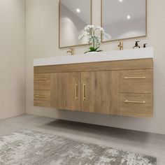 a bathroom vanity with two mirrors above it and a rug on the floor next to it