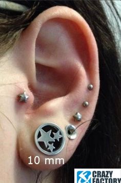 an ear piercing with two stars on it