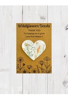 a card with an image of a heart on it and the words, wildflower seeds thank you for helping me to grow love from nature