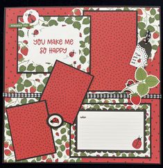 a scrapbook with red and green papers on top of it, surrounded by cherries