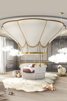 a baby's room with a hot air balloon bed in the middle and toys on the floor