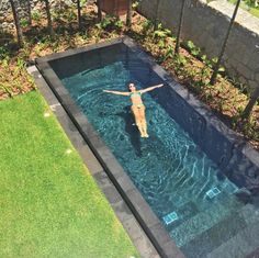 a person standing in the middle of a swimming pool