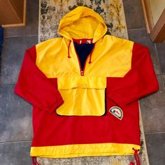 Vintage Dead Stock New With Tags . Concept Clothing Company Pullover Colorblock Jacket . Vintage Sz. L More Of A M Vibrant Red & Yellow With 1/4 Zip And Front Pouch Pocket With Zip Side Entry Pockets . Fold-Away Hood . Vintage Yellow Long Sleeve Windbreaker, Yellow Vintage Long Sleeve Windbreaker, Retro Yellow Outerwear With Pockets, Vintage Yellow Windbreaker For Winter, Retro Yellow Windbreaker For Fall, Yellow Color Block Hooded Outerwear, Yellow Hooded Color Block Outerwear, Retro Yellow Windbreaker For Winter, Retro Yellow Windbreaker For Streetwear