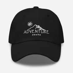 "Adventure Awaits + Mountains Embroidered Baseball Hat / Ball Cap. An illustration of a mountain and sun with the text \"ADVENTURE awaits\" embroidered onto the cap. Adventure awaits those who venture into the great outdoors and nature! This high-quality 100% cotton twill hat is unstructured with a curved visor and adjustable strap. A thoughtful and unique gift for Explorers, Travelers, Adventurers, and Outdoorsmen! HAT INFO: * Low profile dad hat with a curved visor. * Adjustable strap with antique buckle * 100% chino cotton twill * Green Camo color is 35% chino cotton twill, 65% polyester * Unstructured, 6-panel, low-profile * Head circumference: 20 ½″-21 ⅝″ (50.8 cm-53.3 cm) SHIPPING INFO: These hats are made to order. Processing & Production Time: 6-8 business days, typically. Shipping Outdoor Letter Print Hat, Brimmed Hats With Letter Print For Outdoor, Outdoor Letter Print Bucket Hat, Adjustable Bucket Hat With Letter Print For Outdoor, Adjustable Outdoor Bucket Hat With Letter Print, Letter Print Bucket Hat For Outdoor, Letter Print Cap For Outdoor Activities, Outdoor Brimmed Dad Hat, Travel Cap With Letter Print