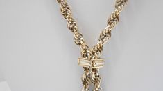 "Vintage gold tone 28\" lariat chain necklace. Intertwined chain links. Pullover necklace...no fastener. Four gold tone dangles. Necklace is adjustable with a square gold tone metal attachment. Classic necklace. Excellent condition. Unsigned." Metal Lariat Necklace For Formal Occasions, Formal Metal Lariat Necklace, Vintage Gold Lariat Necklace With Adjustable Chain, Formal Gold Chain Lariat Necklace, Formal Lariat Toggle Necklace With Chain, Formal Lariat Toggle Necklace, Funky Necklace, Classic Necklace, Chain Links