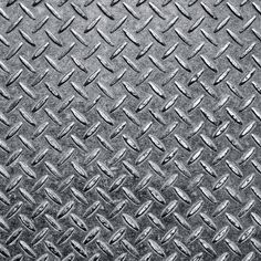 an image of a metal diamond plate textured with black and white colors stock photo