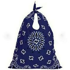 a purple and white bag with a flower design on it's front pocket, hanging from the side