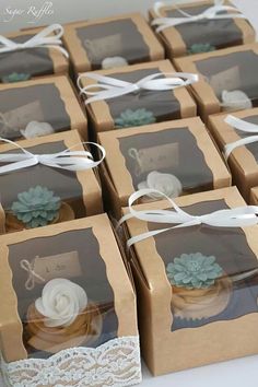 small boxes with lace and succulents on them