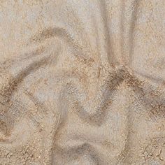 the sand is brown and white with small waves