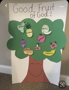 a paper cut out of a tree with fruit on it and the words good fruit of god