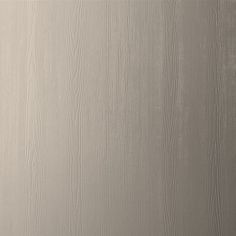 a white wall with wood grain patterning on the bottom and sides, as well as a light gray background