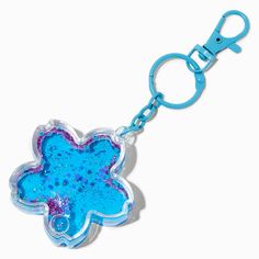 a keychain with a blue and purple flower shaped object on it's side