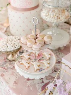 a table topped with lots of desserts and cookies