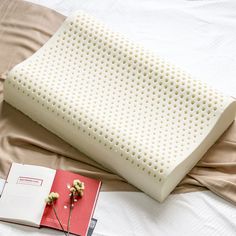 a memory pillow next to an open book