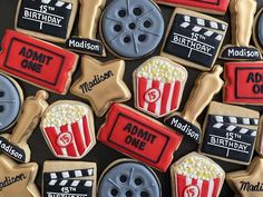 decorated cookies with movie theme on them for an adult only birthday party at the moviestart