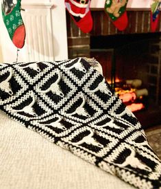 christmas stockings hanging in front of a fireplace