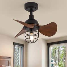 a ceiling fan that is hanging from the ceiling