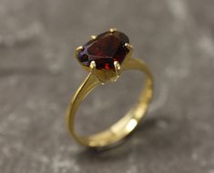 Gold Garnet Ring set with a Natural Garnet in a perfect diamond cut & a deep red color, from Mozambique, at 10x8mm, 3.5 Carats. Promise Ring design made of Gold Vermeil ☞ thickest 18k Gold Plating on top of Solid 925 Sterling Silver ☞ made to last. ☞ Choose your size ☞ I resize (before shipping) for FREE to Any size* Matching Earrings & Matching Pendant - please ask me January Birthstone - Genuine & Natural Stones ❀ ⌛Last Ring left ⌛ ❀ Each Natural Gem is unique & will have Slight variations fro Classic Heart-shaped Ruby Ring For Formal Occasions, Formal Heart Cut Ruby Ring In Yellow Gold, Formal Gold Ruby Ring With Heart Cut, Classic Heart-shaped Ruby Ring, Formal Ruby Heart Ring With Gemstone, Formal Heart Cut Ruby Ring In Fine Jewelry Style, Elegant Heart-shaped Ruby Ring For Formal Occasions, Formal Heart Cut Ruby Ring, Classic Heart-shaped Ruby Ring For Gift