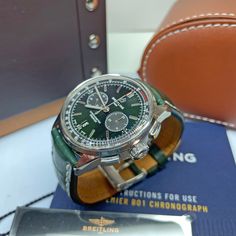 Pre-Owned Breitling Premier 01 Chronrograph 42mm Bentley automatic watch with British Racing Green Dial on Green leather strap. Excellent Condition. Almost Indistinguishable from New. includes All Original Boxes, Papers, Hang Tag, Bezel Protector, Digital Warranty Card from Breitling. 1 Owner Watch Original Purchase Date 12/23/2018 COSC 3244306 Breitling Premier Collection Chronograph Functions 42MM Bentley British Racing Green B01 Automatic Movement Self-Winding Mechanical 28,8000 VHP 70 Hours Luxury Green Chronograph Watch With Subdials, Designer Watch With Chronometer And Round Dial, Luxury Green Chronograph Watch With Tachymeter, Green Chronograph Watch With Tachymeter For Formal Occasions, Formal Green Chronograph Watch With Tachymeter, Green Chronograph Watch With Subdials For Business, Green Chronograph Watch For Business With Subdials, Business Leather Chronograph Mechanical Watch, Luxury Green Watch For Business