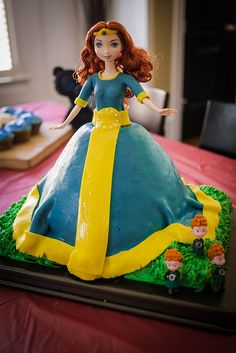 there is a cake shaped like a princess on the table