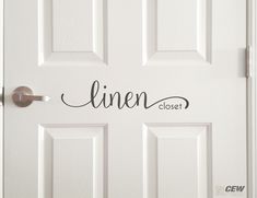 a white door with the word linen closet written on it and an open door handle