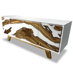 a white and wood sideboard with an abstract design