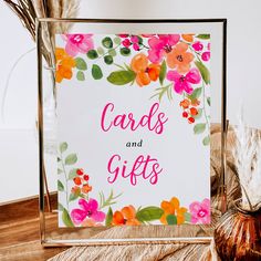 there is a card with flowers on it and the words cards and gifts written in pink