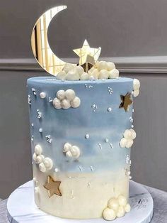 a blue and white cake with stars on it