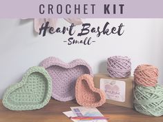 the crochet kit is on display next to some balls of yarn