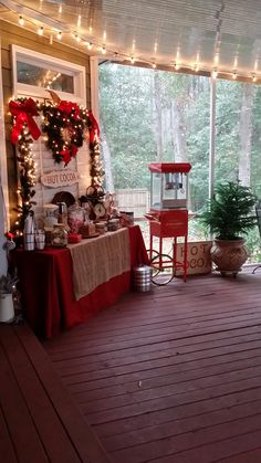 a porch covered in christmas decorations and lights