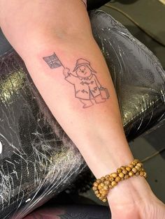 a person with a small tattoo on their arm