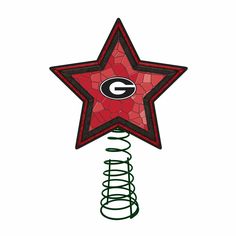 a red and black star shaped decoration with the green bay packers logo on it's side