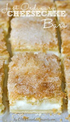 several pieces of cake sitting on top of a white table cloth covered in powdered sugar