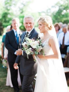 a bride walking down the aisle with her father