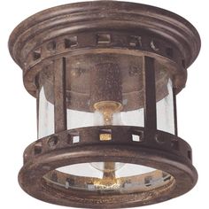 an old fashioned light fixture with glass on the top and bottom part, is shown against a white background