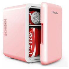 a pink mini fridge with coca cola in it